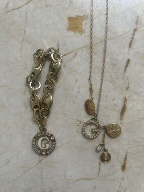 GUESS Gold Charm Necklace and Bracelet Set